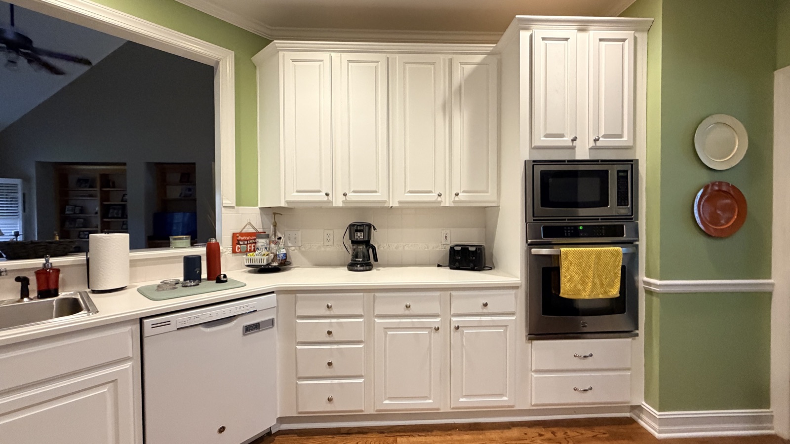 Real painted cabinets in White Flour, a Cabinet Painting Guys client job (kitchen shown; the same factory-smooth process is used on bathroom vanities)